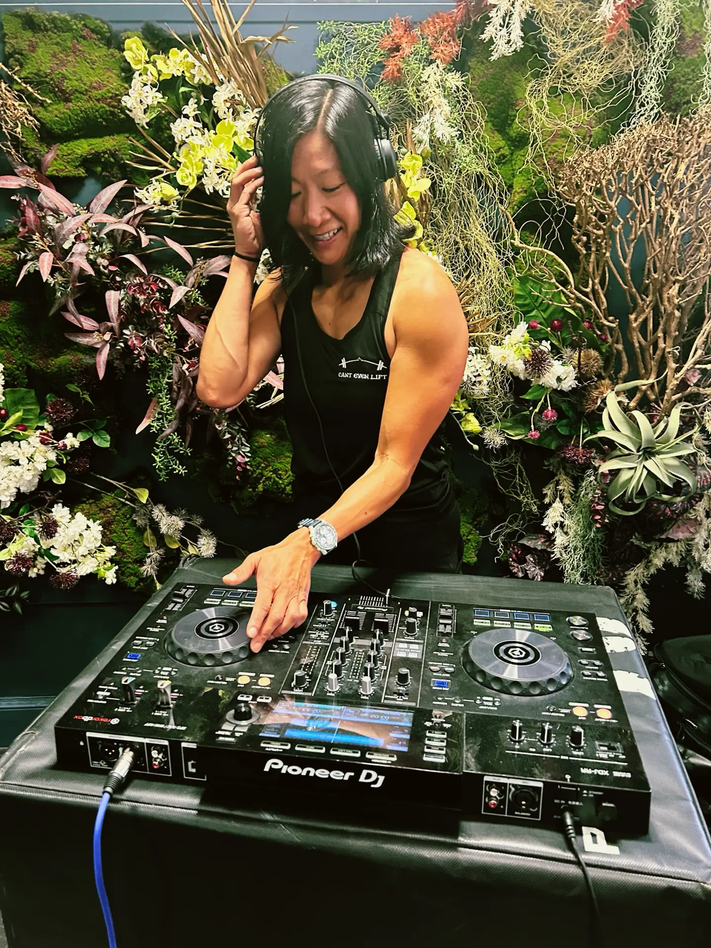 DJ Lu on the decks at a rooftop event