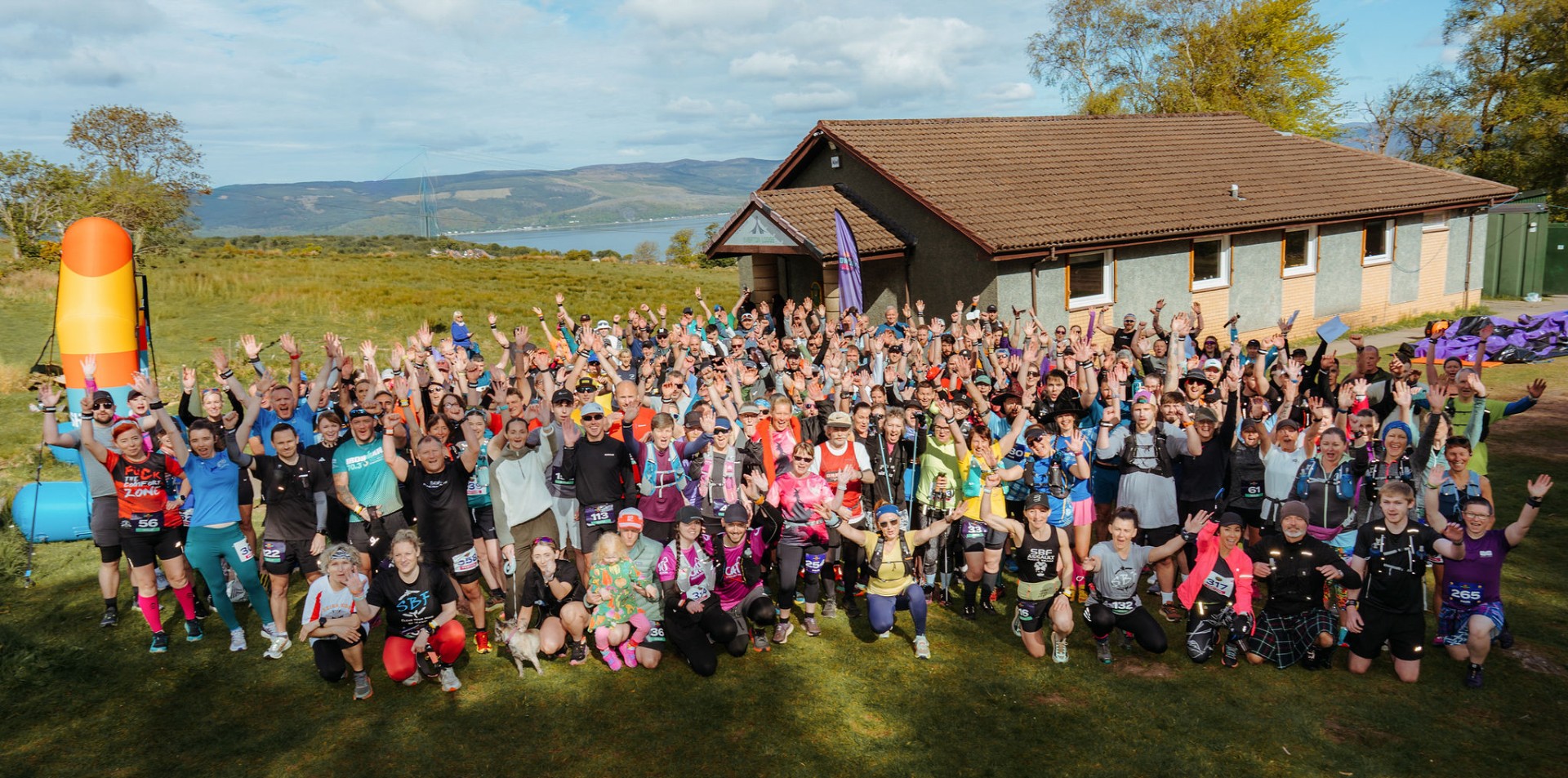 The full Witchwood Run field, hands in the air, firth behind