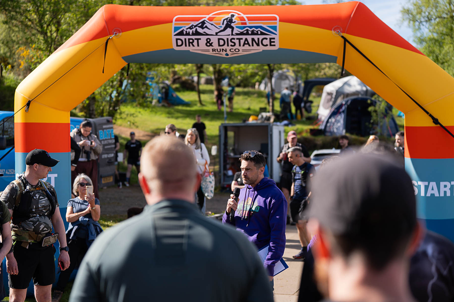 Race briefing under the Dirt & Distance arch