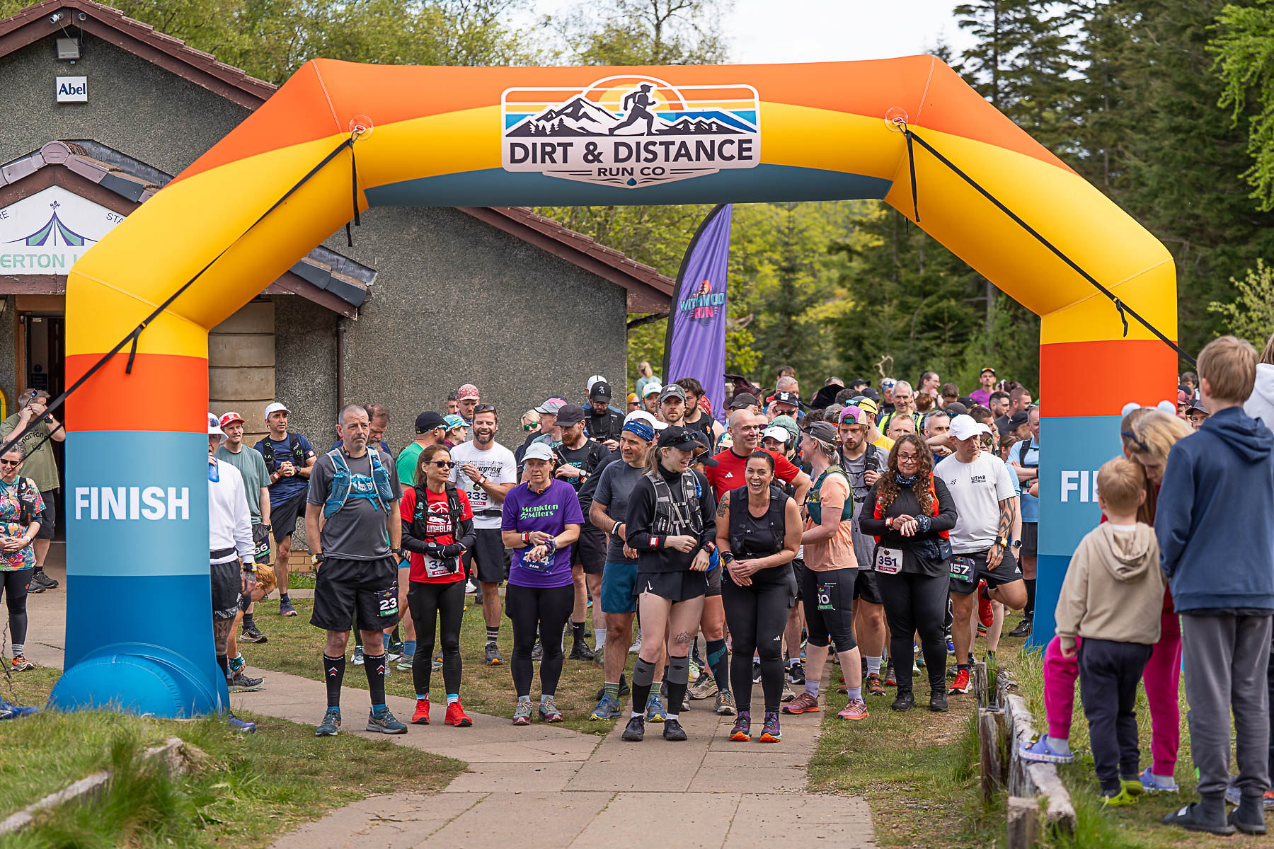 Pack of runners launching under the start arch